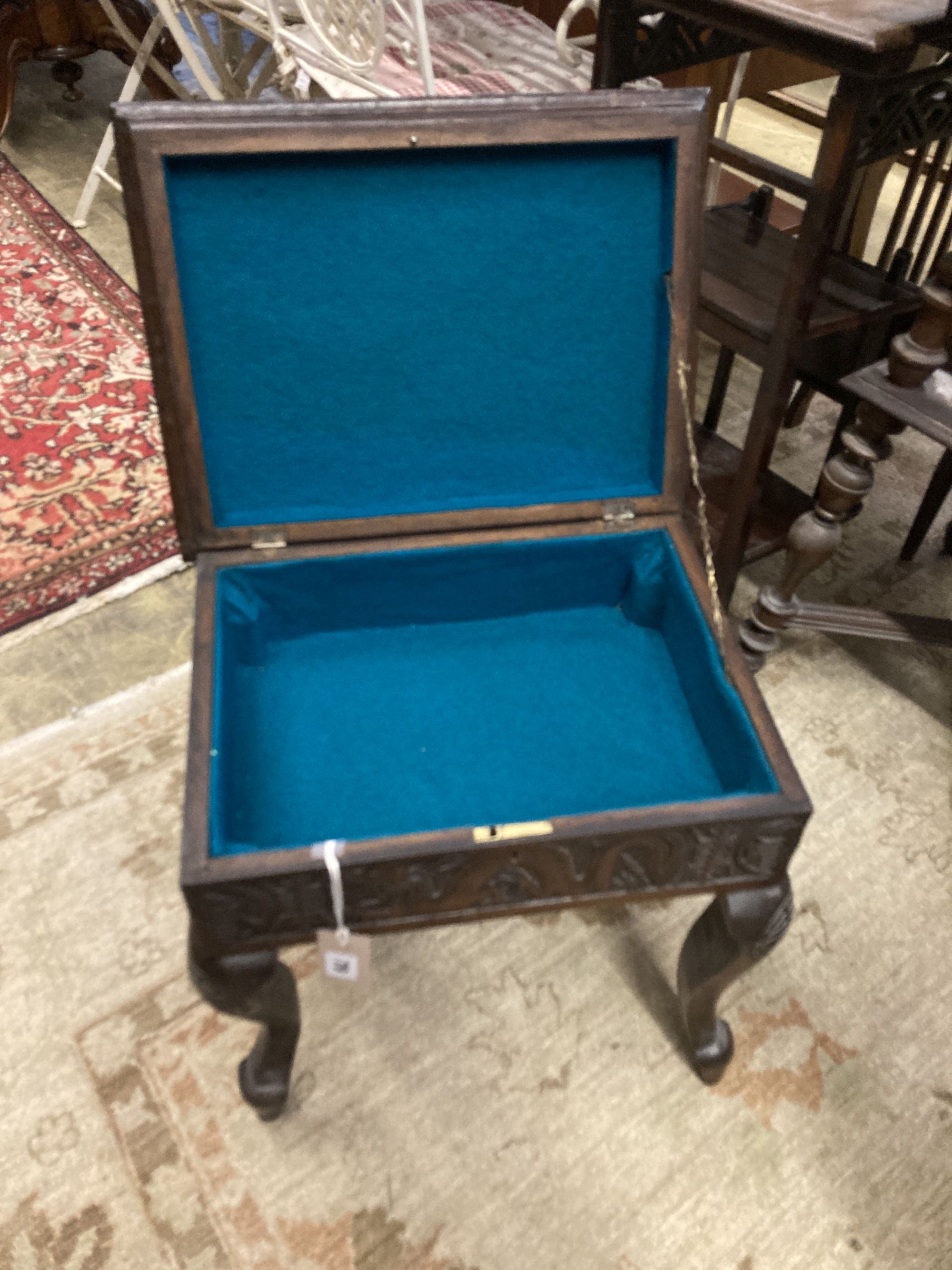 A Burmese carved box seat stool, width 44cm, depth 34cm, height 45cm and a similar two tier plant stand